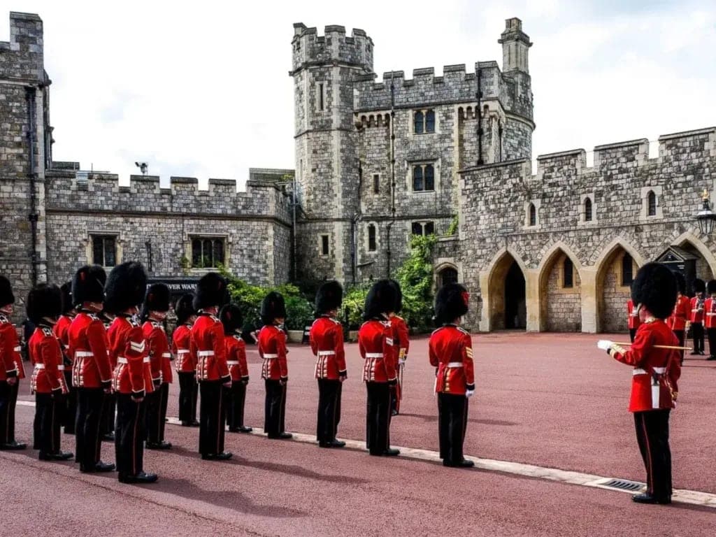 Guards in red tunics and bearskin hats during the Changing of the Guard
