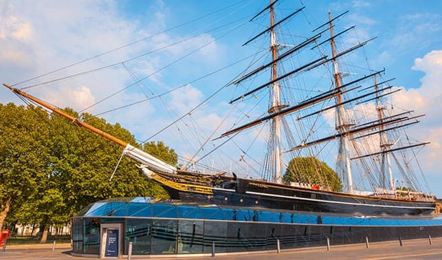The tall masts and rigging of the Cutty Sark in dry dock