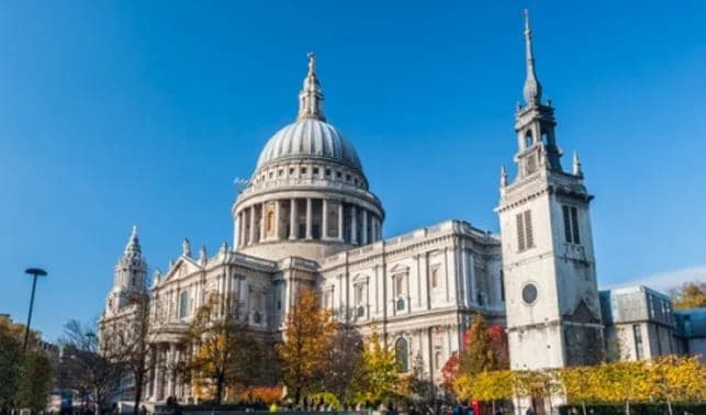 The dome and west towers of St Paul's Cathedral against a blue sky