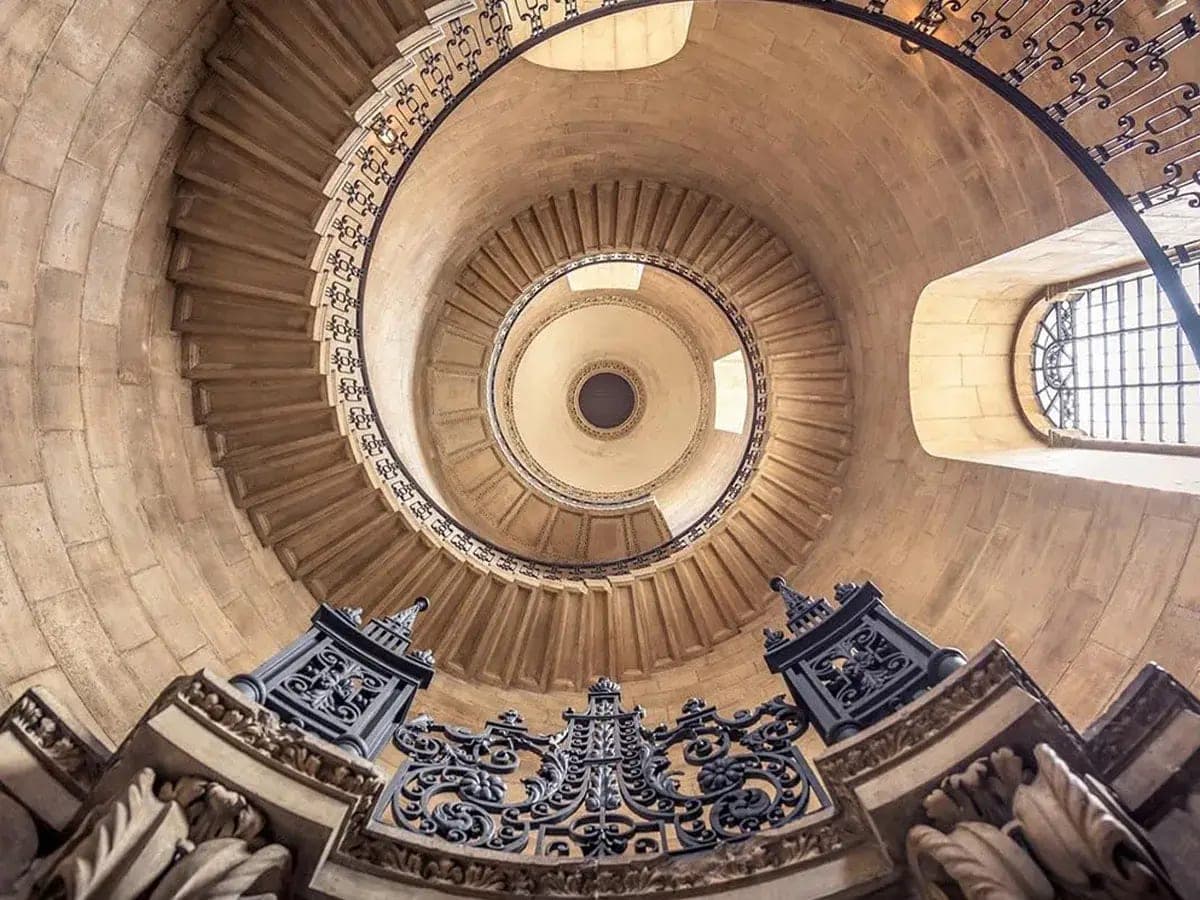 Looking up the spiral geometric staircase inside St Paul's Cathedral